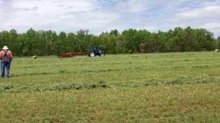 Kuhn SR 310 Wheel Rake under New Holland power 2013 NC Hay Day [upl. by Whatley238]