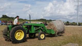 Used John Deere 2350 moving a round bale [upl. by Narat]