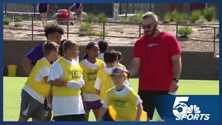 Denver Bronco helps coach Colorado Springs children at football camp Monday [upl. by Otinauj]