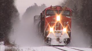 Kicking Up Snow  Awesome Approach View Freight Train CN 594 West near Boundary Creek NB [upl. by Adnawaj80]