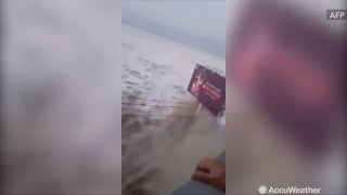 Terrifying footage shows tsunami crash into island of Palu in Indonesia [upl. by Endo]