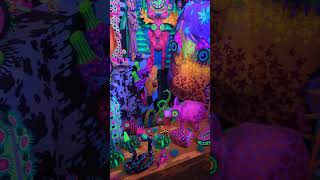 Meow Wolf Houston  huge neon diorama hidden behind an electrical panel door [upl. by Ahsinrev127]