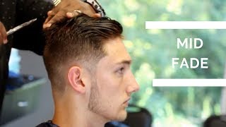 Barber Tutorial Mid Fade Haircut with textured top [upl. by Colene118]