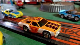 AFX Chevy Chevelle vs Car Thief  Vintage HO Slot Cars  Corvette [upl. by Lorry]