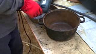 remove rust from cast iron pots using a drill with wire brush [upl. by Aicilyt576]