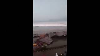 The moment the massive waves crash on shore as tsunami hits Indonesian island of Sulawesi [upl. by Akenet]