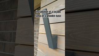 installation of a façade lamp on a wooden base [upl. by Anhsirk]