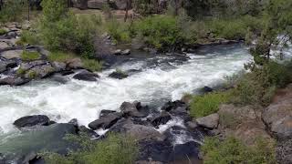 Kayaker shooting Class 4 Deschutes River rapids upstream from Bend Oregon 20190713 [upl. by Dacy]