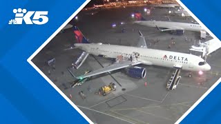 New video shows moments when nose of Delta plane briefly catches fire at SEA Airport [upl. by Zosema]