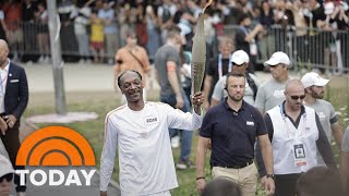 Watch Snoop Dogg carry the Olympic torch into Paris [upl. by Ellatsyrc162]