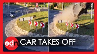 Shocking Moment Car ‘Flies Over Roundabout in Poland [upl. by Barnaby]