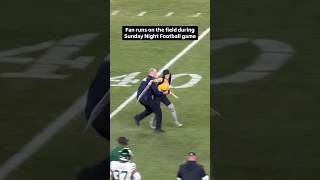 A fan runs onto the field during the Sunday Night Football Game [upl. by Secilu]