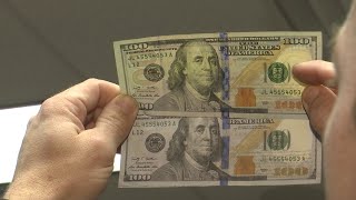 WEB EXTRA Comparing a fake and real 100 bill [upl. by Aroved]