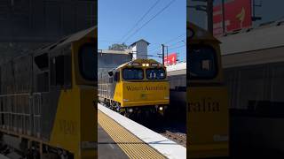 Watco grain train WRA001004 passing Lawnton station with 2 horn toots [upl. by Kcirdek]