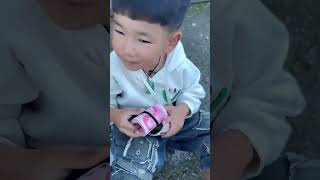 Dad takes his child out for a walk while playing with his phone His son kicks the boy next door [upl. by Rodoeht]