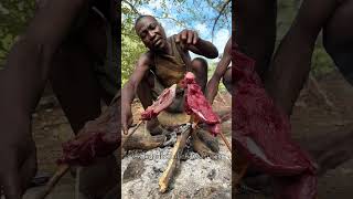 Hadzabe bushmen cook their steak meat naturally in the forest over the fire [upl. by Gnanmos865]