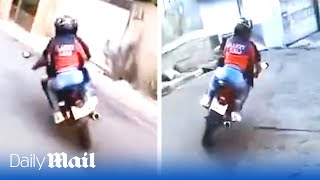 Motorcyclist in highspeed police chase through Brazil’s favelas with woman on the back of his bike [upl. by Norret]