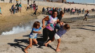 Hundreds of migrants try to storm US border [upl. by Anilejna]