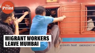 Migrant labourers leave Mumbai in jampacked train amid new Covid restrictions [upl. by Anertal848]