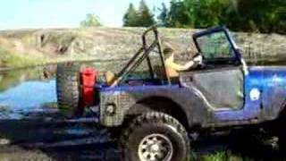 9 year old driving a 1979 Jeep CJ5 in mud [upl. by Kerred923]