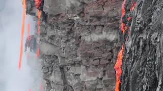 Lava Drips From Kilauea Cliff Face Into Pacific Ocean FILE [upl. by Corbie115]