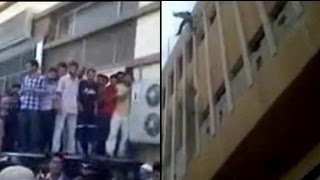 Los rebeldes sirios tiran cadáveres de soldados desde la azotea de un edificio de Alepo [upl. by Elly]