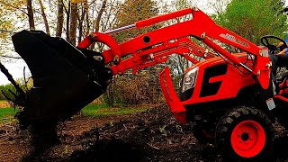 Spreading Dirt Pile with a Kioti CX2510 Compact Tractor [upl. by Mcgrody]