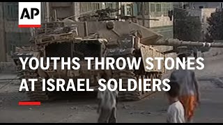 Youths throw stones at Israel soldiers [upl. by Manolo608]