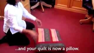 How to fold a Quillow  folding instructions  Natural Quilts [upl. by Annairt]