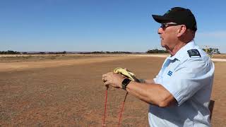 Chief Flying Instructor Gary Williams covering the rotor blade and tying it to the gyroplane [upl. by Kelsi]