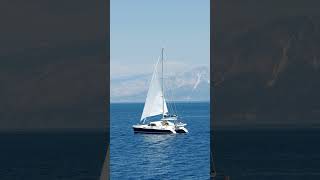 catamaranyachtsailinginopenblueseacoastline automobile [upl. by Aeneas]