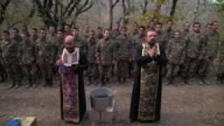 Priest baptises new recruits in NagornoKarabakh [upl. by Benkley]