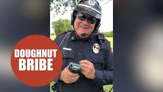 Hilarious footage shows a policeman being bribed with a doughnut [upl. by Sarkaria]