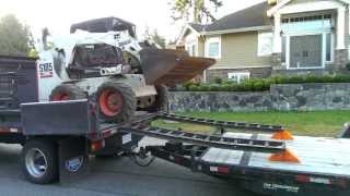 Crazy landscapers unload bobcat [upl. by Frieder]