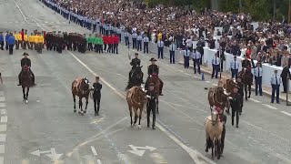 Frances Bastille Day parade meets the Olympic torch relay in an exceptional year [upl. by Albarran853]