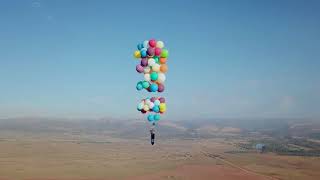 Man Strapped to 100 Helium Balloons Flies 8000 feet up in the Air in South Africa [upl. by Tutt]