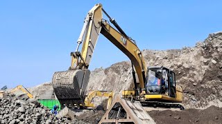 Caterpillar excavator works loading sand into a dump truck  4k [upl. by Guevara]