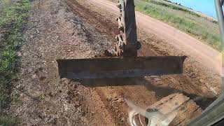 350EXCAVATOR PREPARING SITE FOR NEW FENCE using 12ft grader blade attachment [upl. by Anihc]