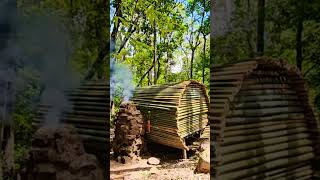 Build a warm bamboo house and stove cooking survival camping bushcraft building [upl. by Yvi]