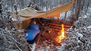 Winter Camping in Snow Storm with Survival Shelter amp Bushcraft Cot [upl. by Arlie]