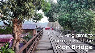 Thailand Holiday  Day 13  Giving alms to monks at Mon Bridge [upl. by Kentiggerma]