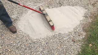 brushing CHEAP concrete onto a gravel driveway adding strength and resilience [upl. by Aicad]