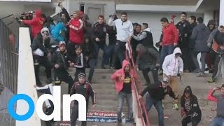 Football fans in Chile attack riot police [upl. by Martell]