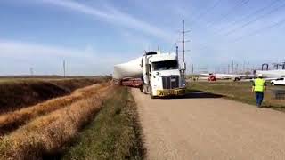 Truck Hauling Giant Wind Generator Blade Almost Rolls In Grand Forks [upl. by Yerak]