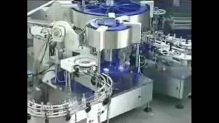 IC Filling Systems Electronic cam cold glue labeller with tax strip [upl. by Attenehs]