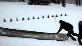 Winter in Michigan Redneck downhill sledding in the canoe [upl. by Frohman528]