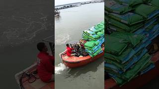 With the help of this boat this man loads sacks of salt and takes them to the ships [upl. by Eimma]