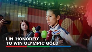 Taiwans Lin poses with gold medal in victory despite gender row  ABSCBN News [upl. by Ennyroc249]