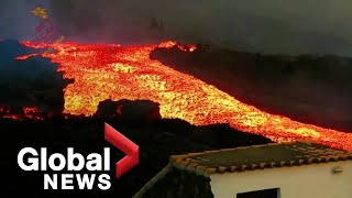 La Palma volcano Lava quottsunamiquot gushes down hillside after overflowing main cone [upl. by Savior]