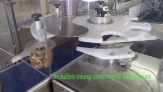 SpinDexer 1800 accurately weigh filling nuts into plastic containers [upl. by Eleinad]